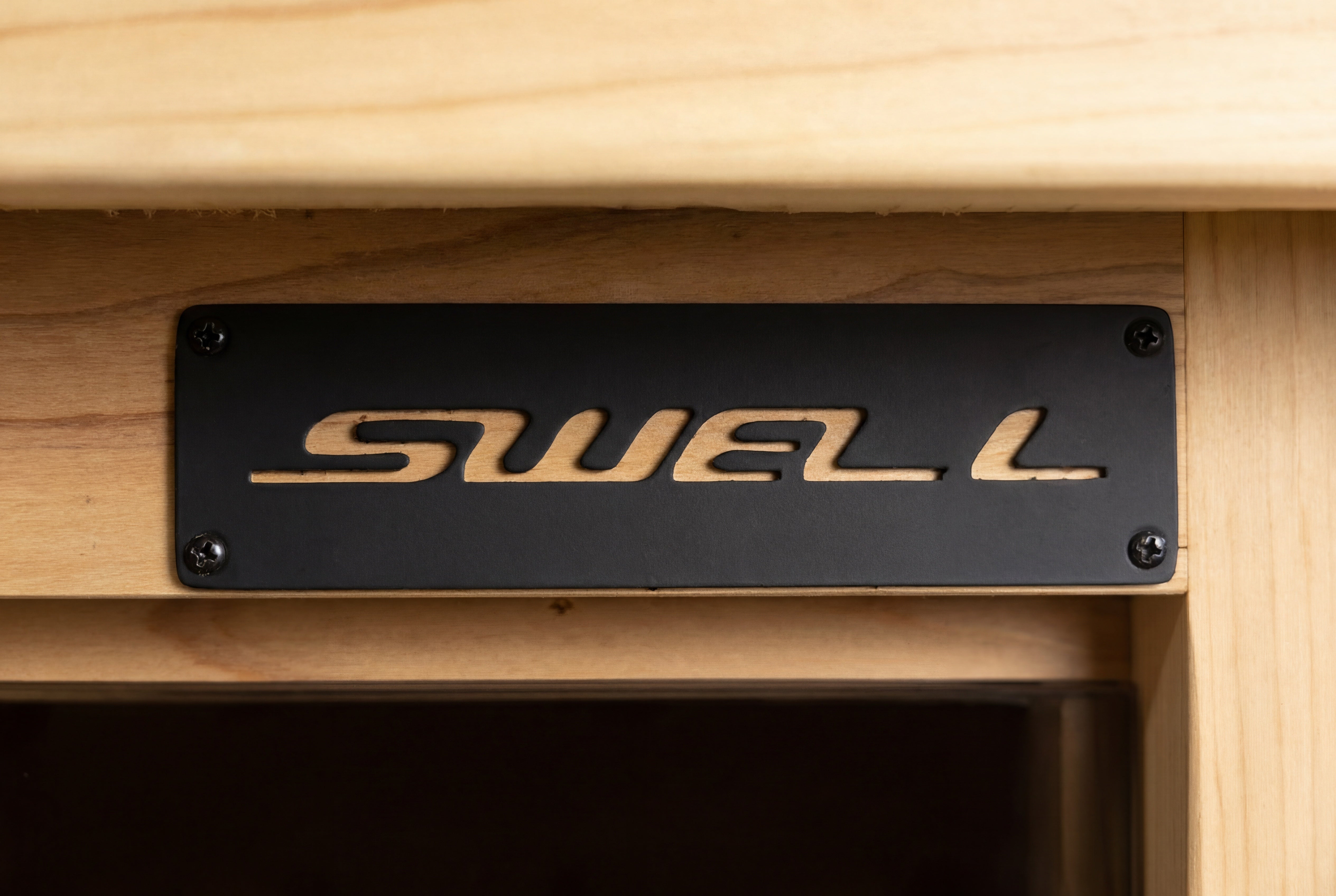 Swell Sport brand badge on Cedar Cube 2 outdoor sauna and cedar sauna exterior