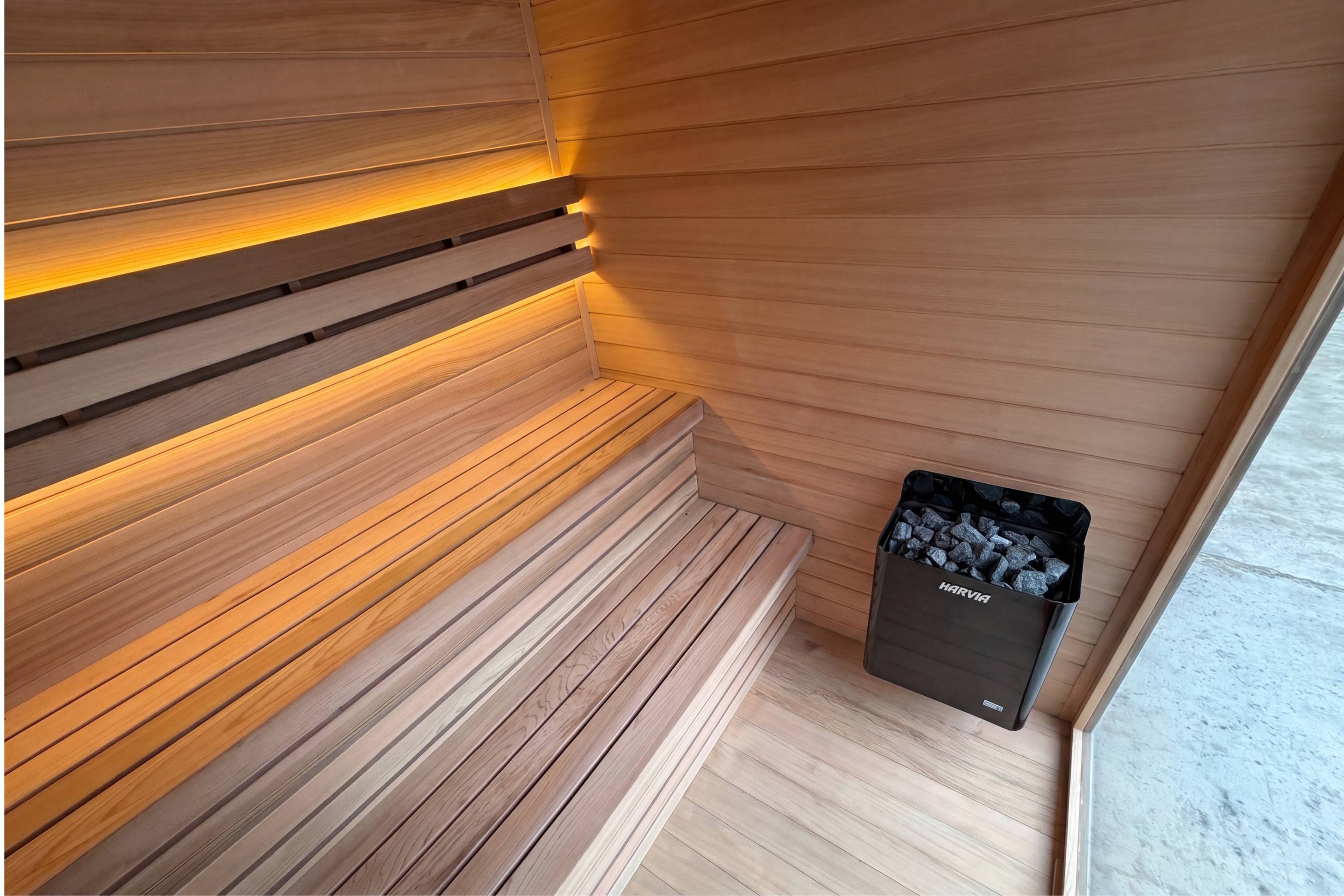 Swell Black Eco 4 cedar sauna interior with bench lighting and Harvia electric heater