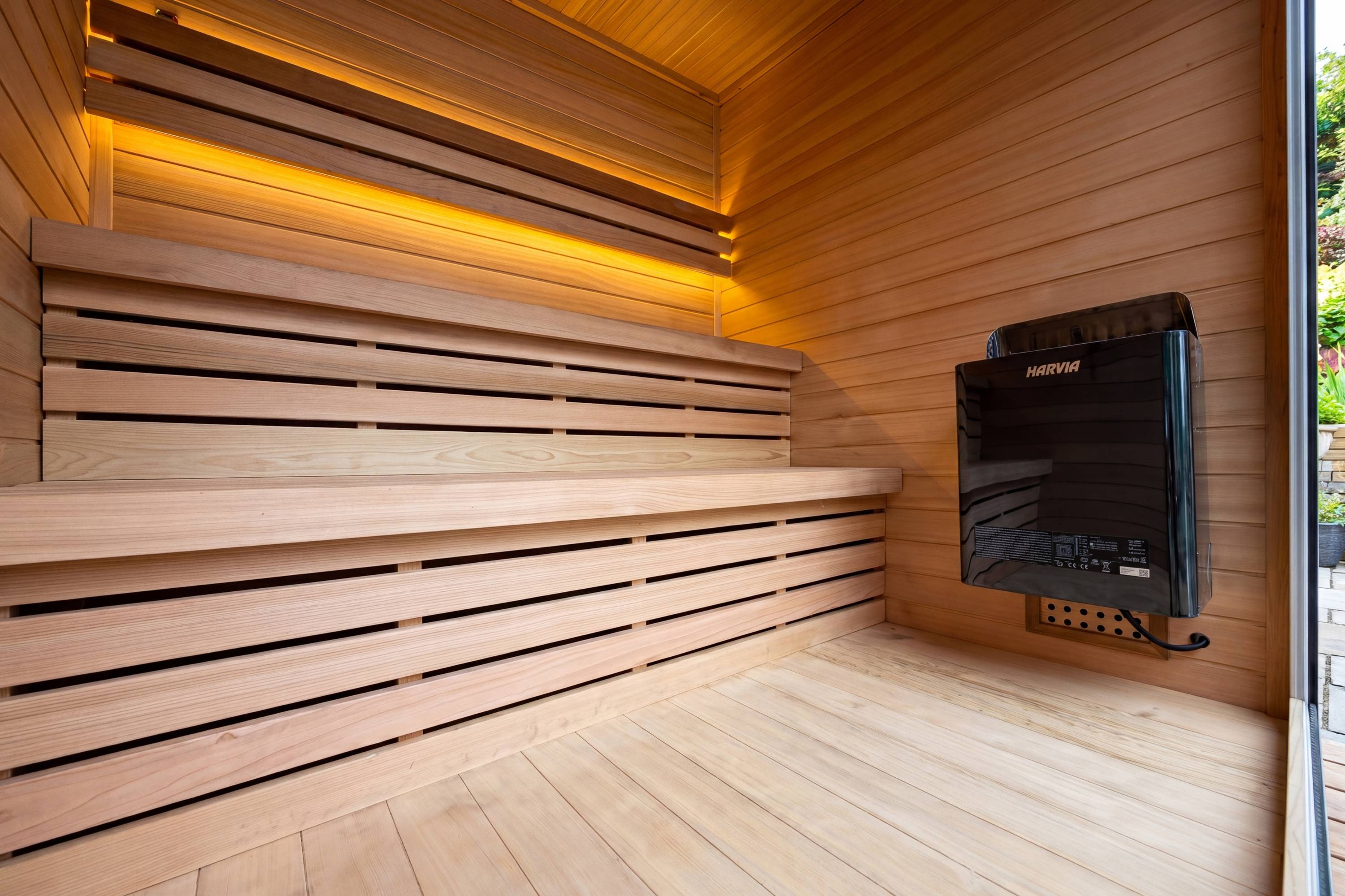 Swell Black Eco 4 cedar sauna interior with tiered benches and Harvia heater