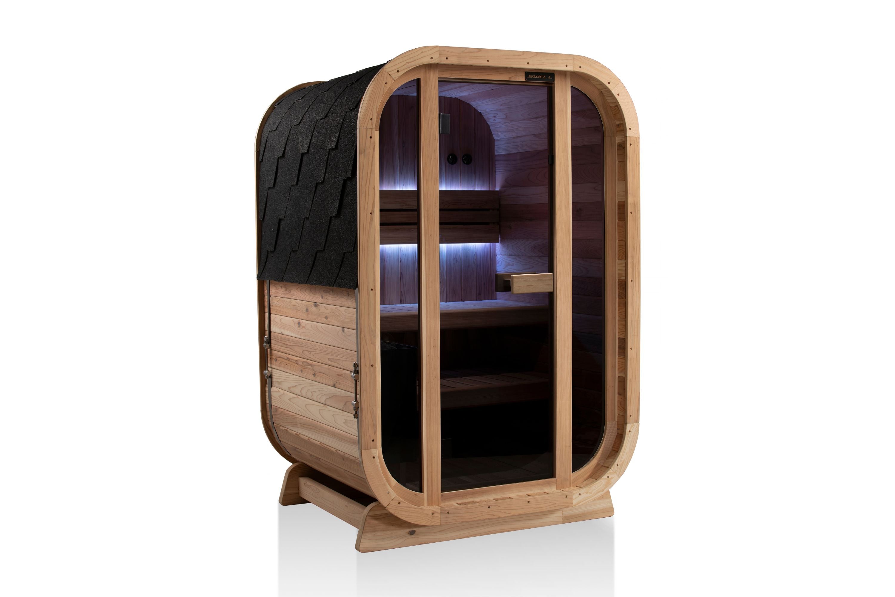 Angled view of a Swell Cedar Cube 2 outdoor sauna with glass front and purple interior lighting