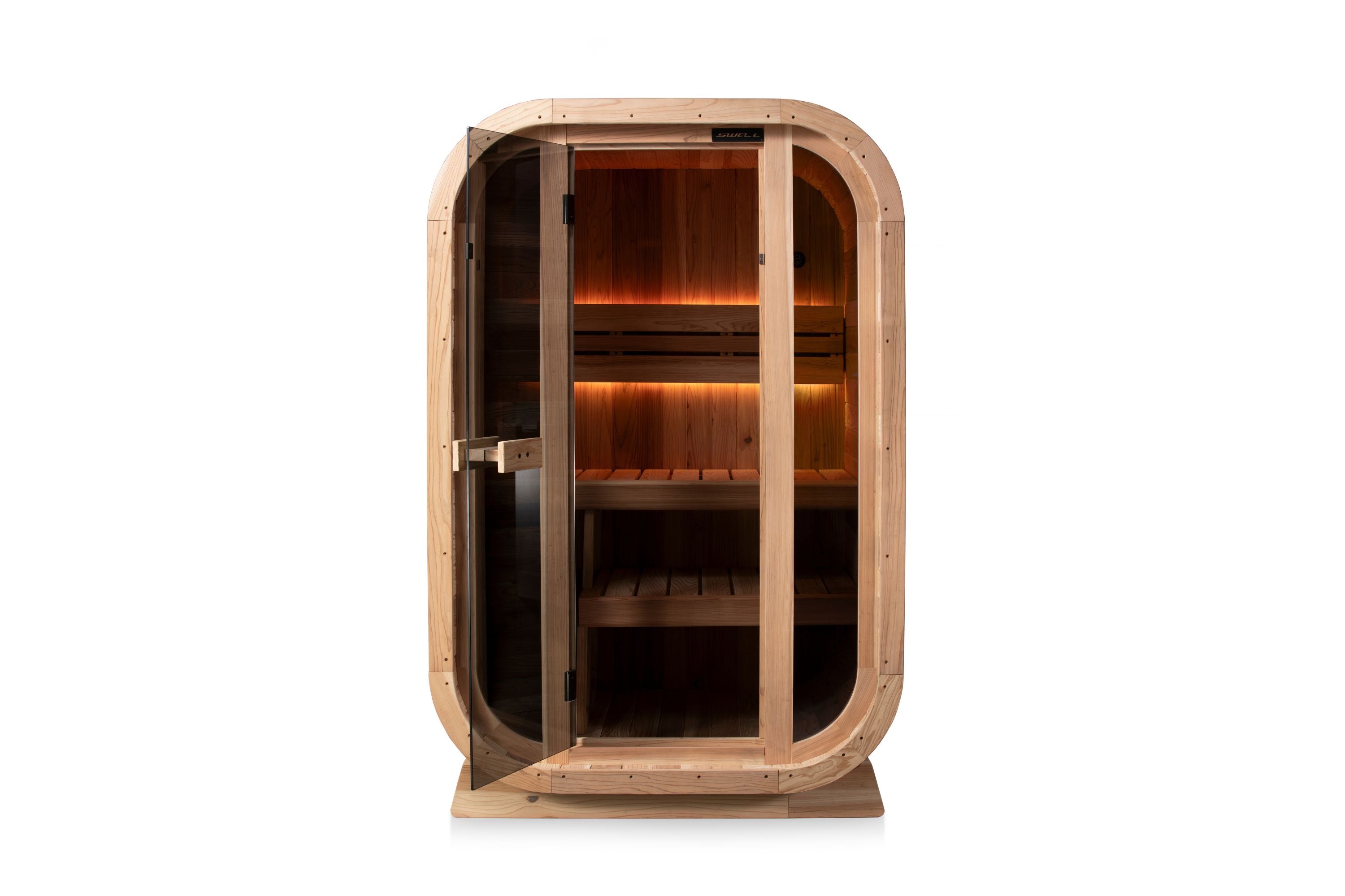 Front view of a Swell Cedar Cube 2 sauna with warm amber bench lighting