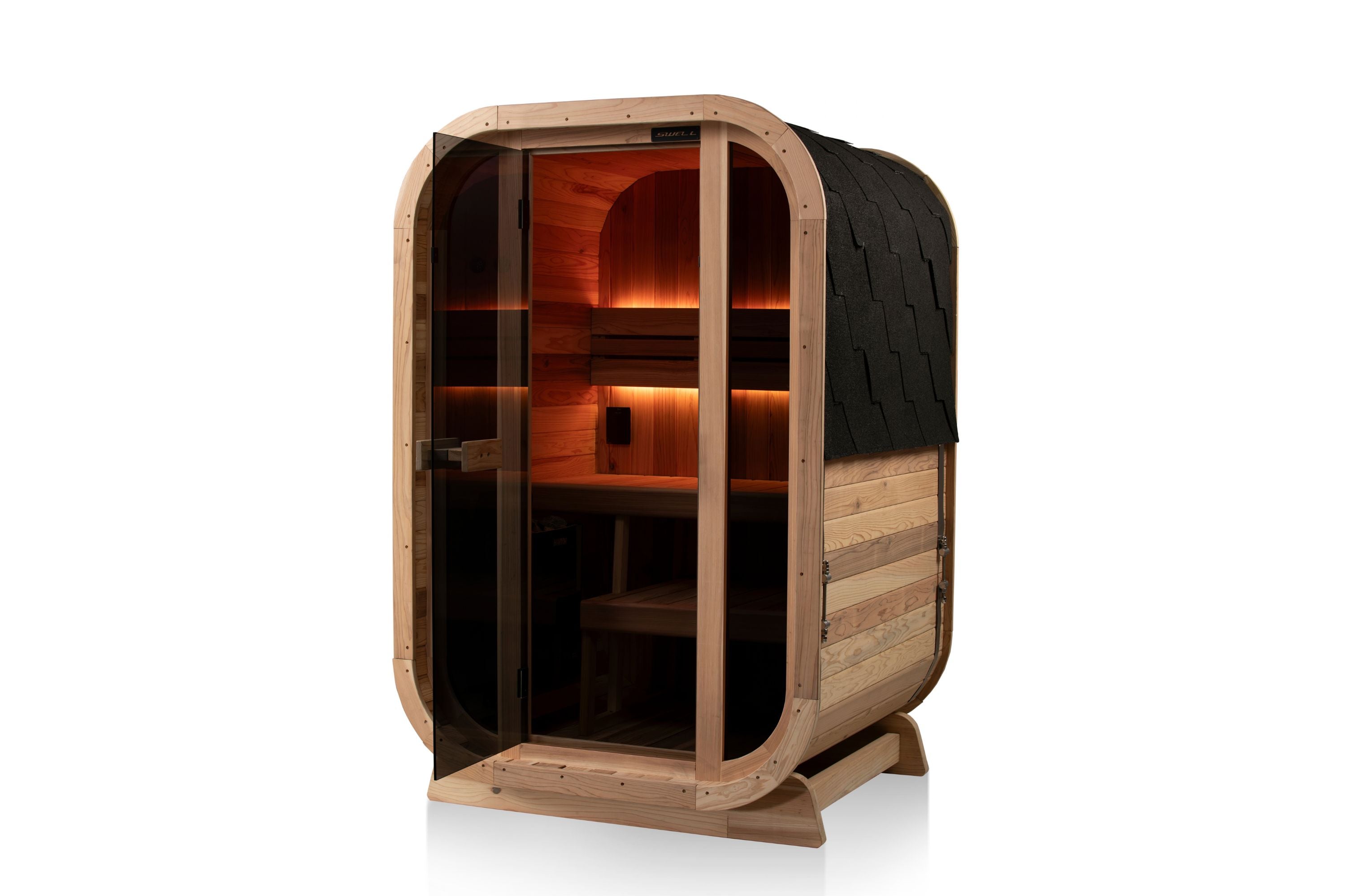 Swell Cedar Cube 2 sauna with warm amber interior lighting and curved timber frame